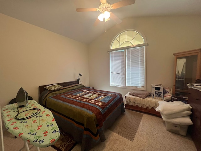 bedroom with carpet floors, lofted ceiling, and ceiling fan