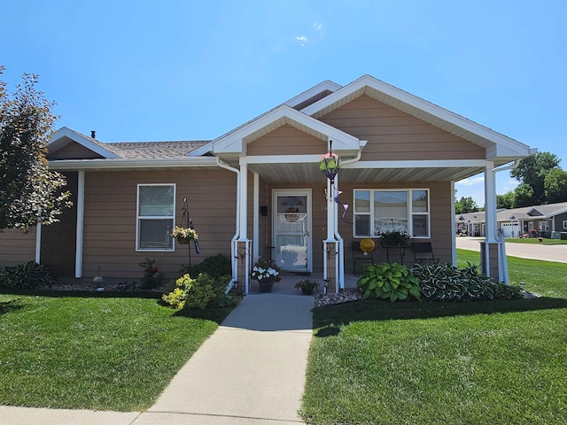 view of front of house with covered porch and a front yard