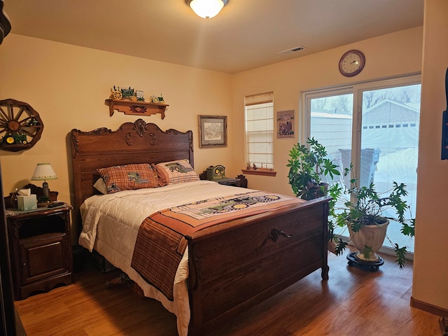 bedroom with hardwood / wood-style floors