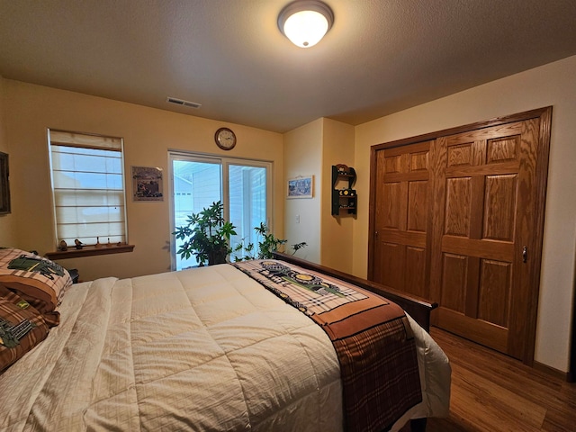 bedroom featuring a closet and hardwood / wood-style floors