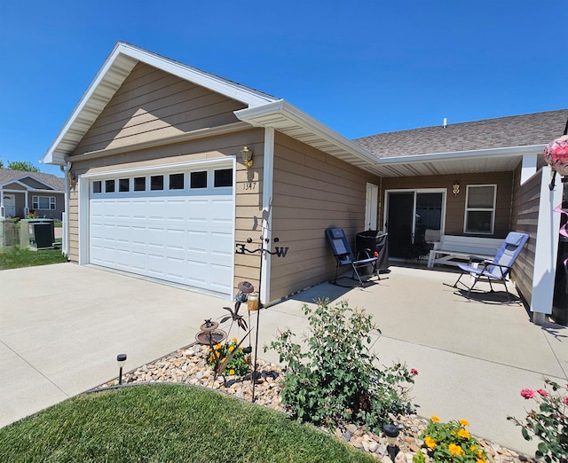 view of side of home with a garage