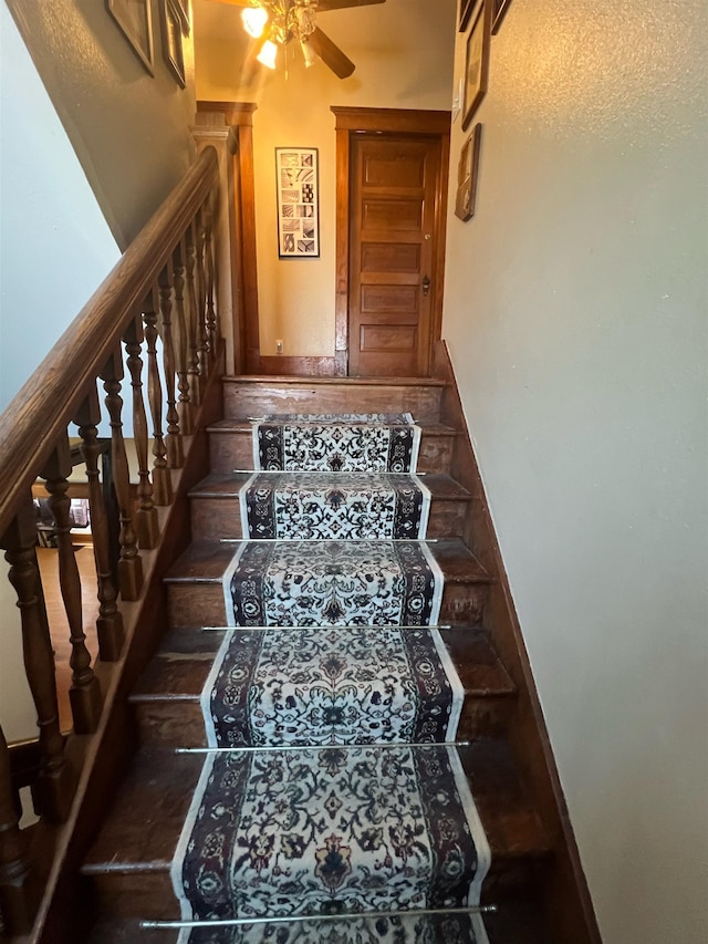 stairs with ceiling fan