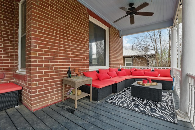 deck with an outdoor hangout area and a ceiling fan