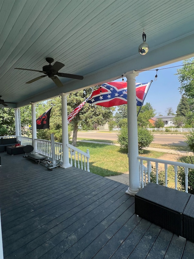 wooden terrace featuring ceiling fan