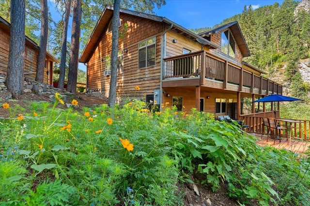 view of side of home featuring a deck