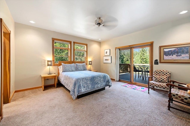 bedroom featuring access to exterior, multiple windows, ceiling fan, and carpet flooring