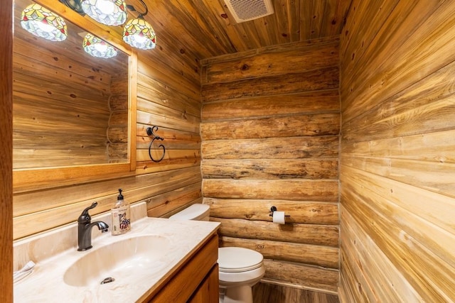 23470 Mineral Ln, Hill City, SD 57745 - bathroom with vanity, toilet, and hardwood / wood-style floors