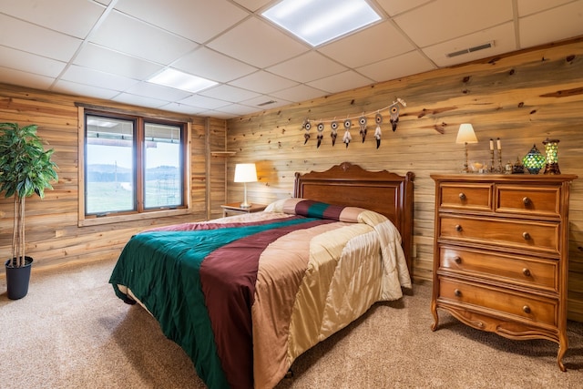 23470 Mineral Ln, Hill City, SD 57745 - bedroom with a paneled ceiling, light colored carpet, and wooden walls