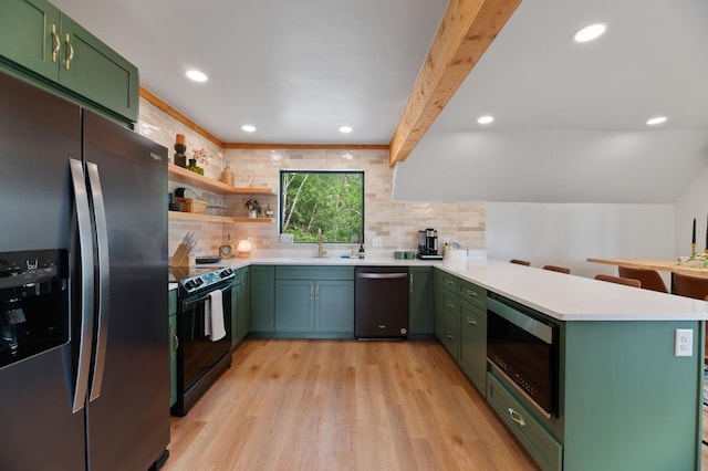 kitchen with kitchen peninsula, beamed ceiling, light hardwood / wood-style floors, appliances with stainless steel finishes, and decorative backsplash