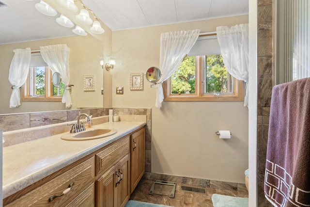 bathroom with tile patterned flooring and vanity