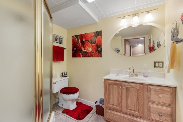 bathroom with vanity, toilet, tile patterned flooring, and walk in shower