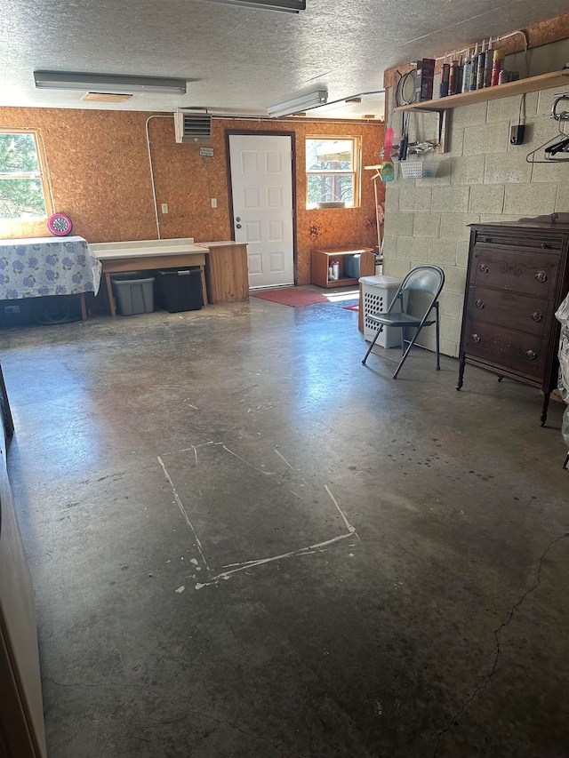 basement featuring a textured ceiling