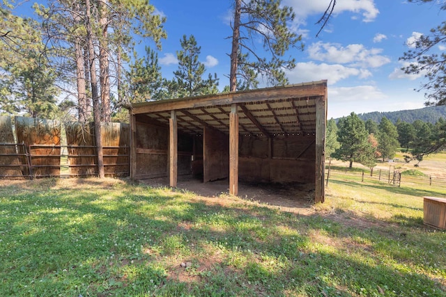 view of outbuilding featuring a yard