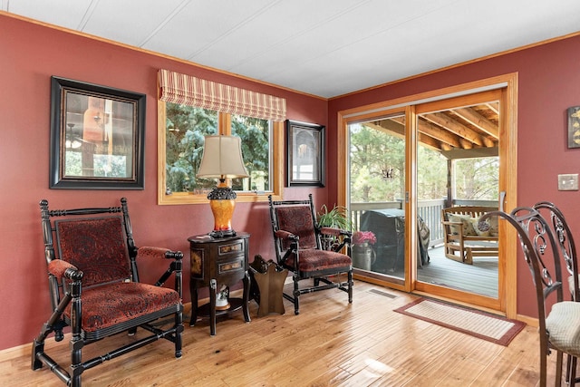 sitting room with light hardwood / wood-style floors