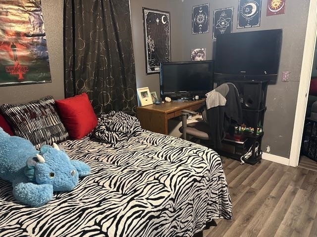 bedroom featuring wood-type flooring