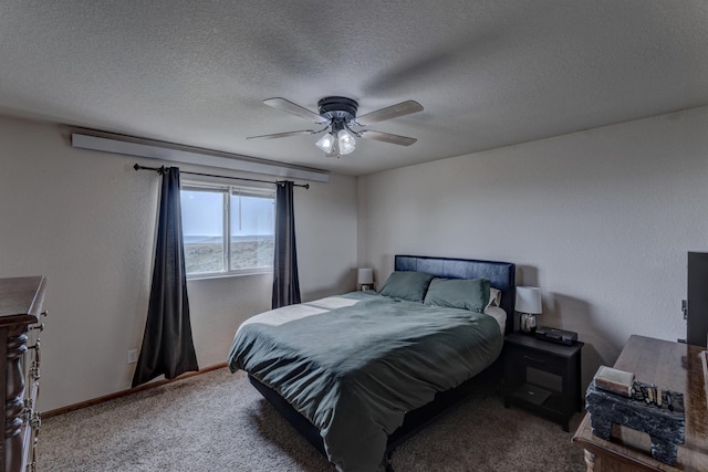 carpeted bedroom featuring ceiling fan and a textured ceiling