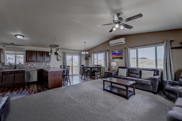 living room featuring sink, vaulted ceiling, a wall unit AC, and ceiling fan