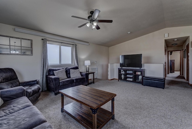 carpeted living room featuring vaulted ceiling and ceiling fan