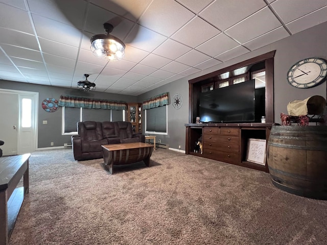 living room with carpet, ceiling fan, a drop ceiling, and baseboard heating