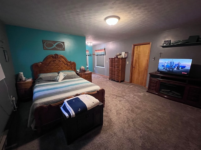 bedroom with carpet floors and a textured ceiling