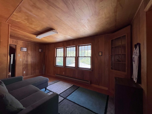 living room with wooden walls, a baseboard radiator, and wooden ceiling