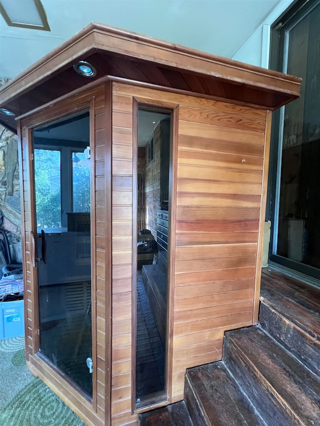 view of sauna / steam room with wooden walls