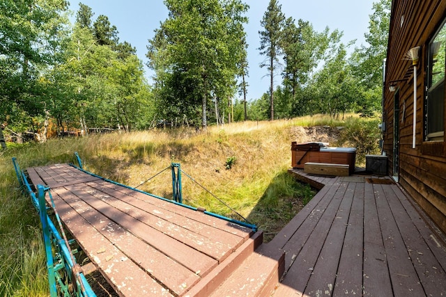 view of dock with a hot tub