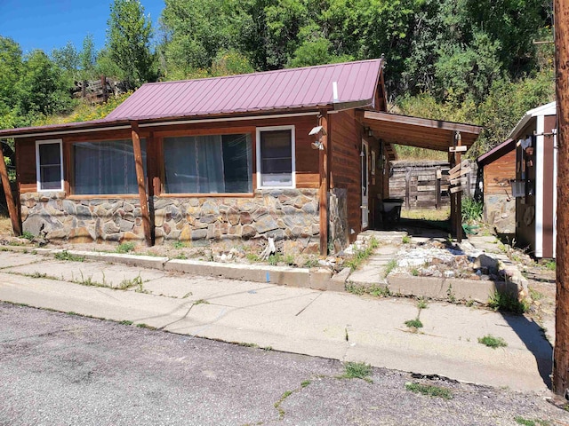 view of side of property featuring a carport