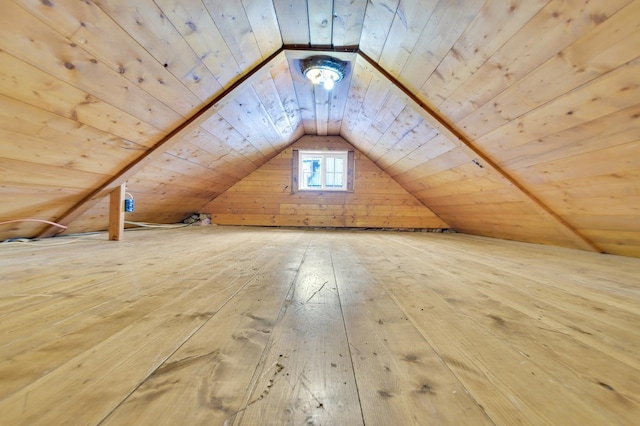 bonus room featuring hardwood / wood-style flooring, lofted ceiling, wood walls, and wood ceiling