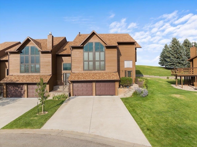 view of front of home featuring a garage and a front lawn