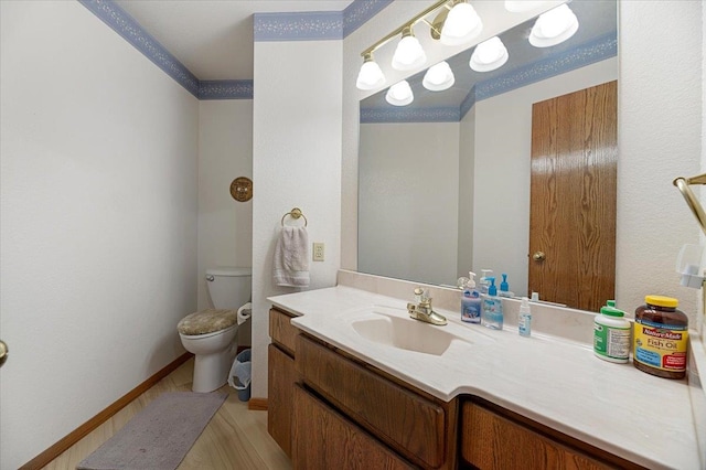 bathroom with vanity, toilet, and tile patterned flooring