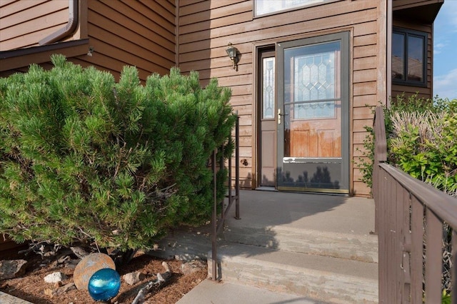 doorway to property with a patio area