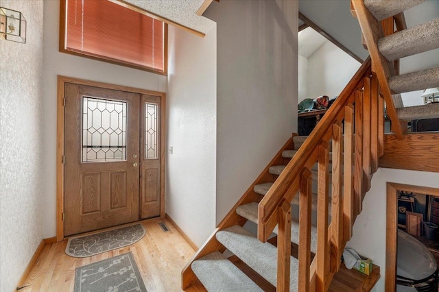 entrance foyer with light hardwood / wood-style flooring