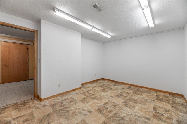 empty room with a textured ceiling