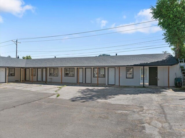 230 N Main St, Spearfish, SD 57783 - view of front of house with a shingled roof and board and batten siding