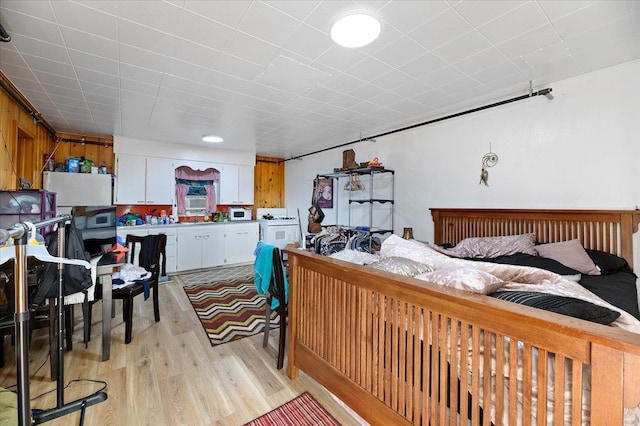 bedroom with light hardwood / wood-style floors