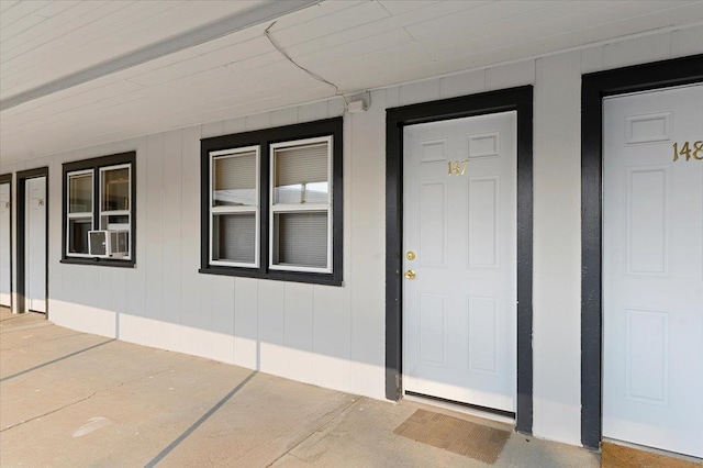 doorway to property with cooling unit