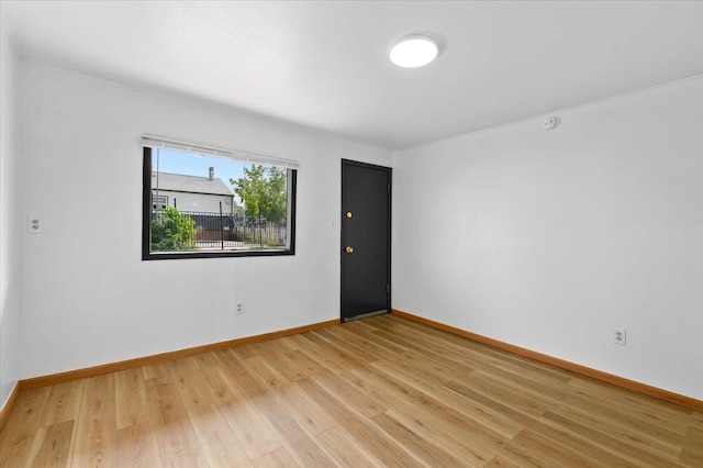 spare room featuring light wood-type flooring