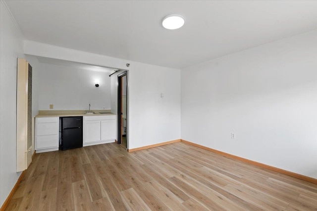 unfurnished living room featuring light wood-type flooring