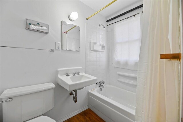 230 N Main St, Spearfish, SD 57783 - full bathroom with shower / bath combo, toilet, wood finished floors, and a sink