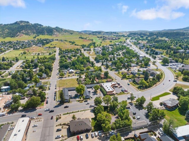 230 N Main St, Spearfish, SD 57783 - aerial view of property and surrounding area with a mountain backdrop