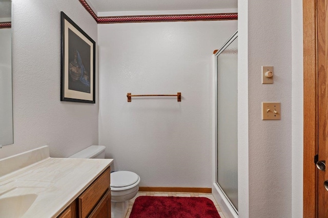 bathroom with vanity, toilet, tile patterned flooring, and an enclosed shower