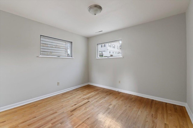 spare room featuring light hardwood / wood-style floors