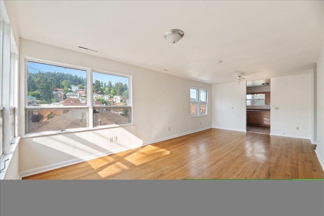 unfurnished living room featuring light hardwood / wood-style flooring