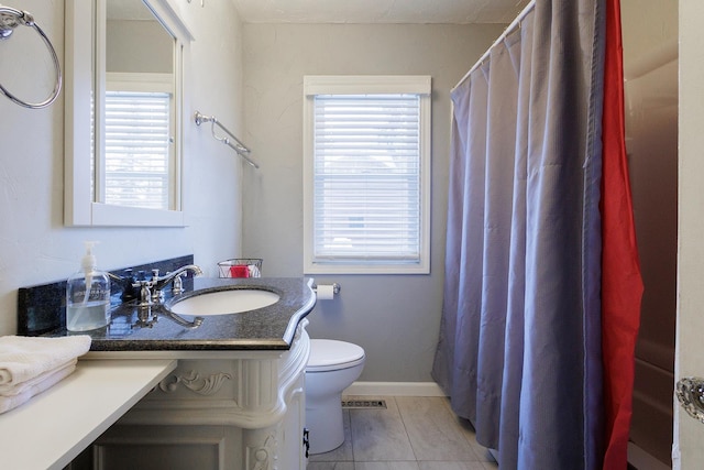 full bath with visible vents, toilet, tile patterned flooring, baseboards, and vanity