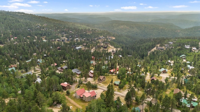 bird's eye view with a mountain view and a forest view