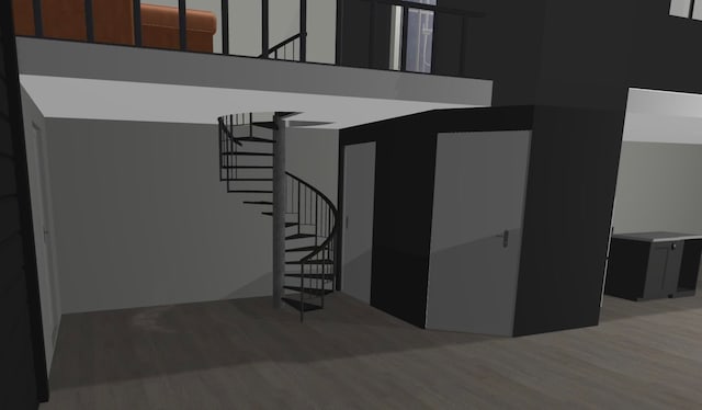 stairway featuring hardwood / wood-style floors