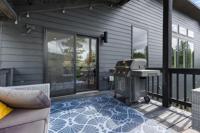 wooden terrace featuring grilling area