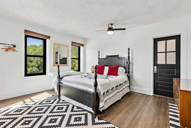 bedroom with ceiling fan and hardwood / wood-style floors