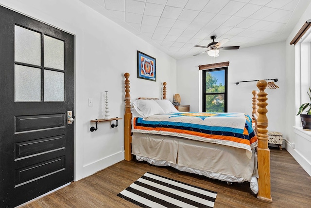 bedroom featuring ceiling fan and dark wood-type flooring